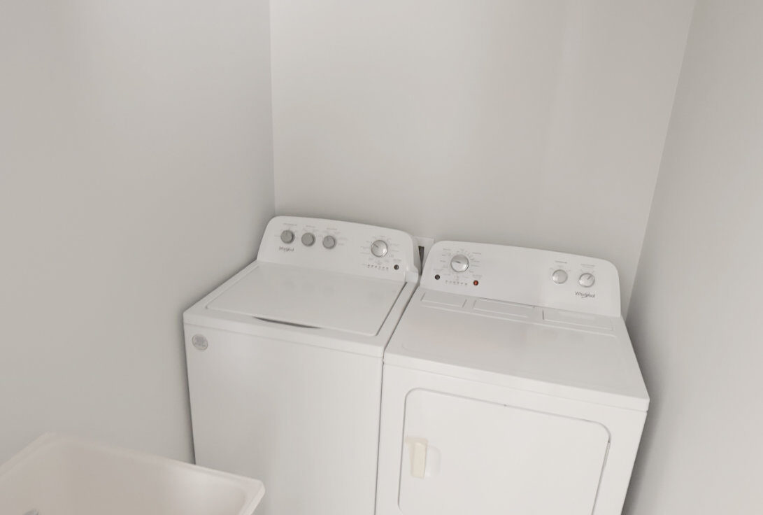 Laundry area with washer, dryer and laundry tub